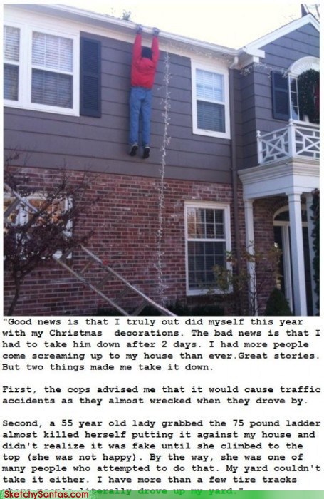 Christmas decoration of fake man hanging from roof of house while decorating home