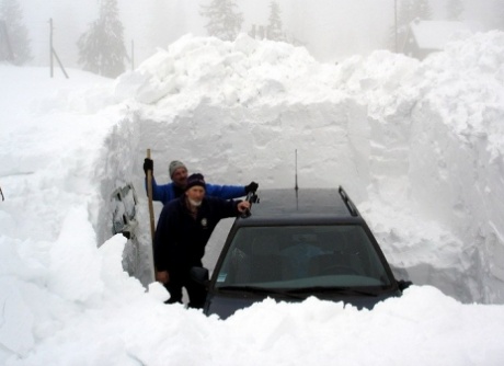 Digging out car buried deep in snow
