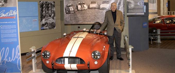 Carroll Shelby with orange cobra white racing stripes