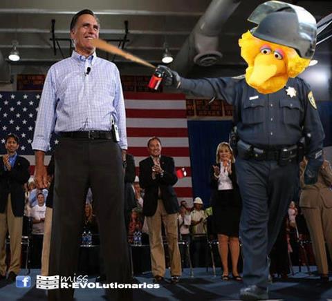 Romney being sprayed by the pepper-spraying Big Bird