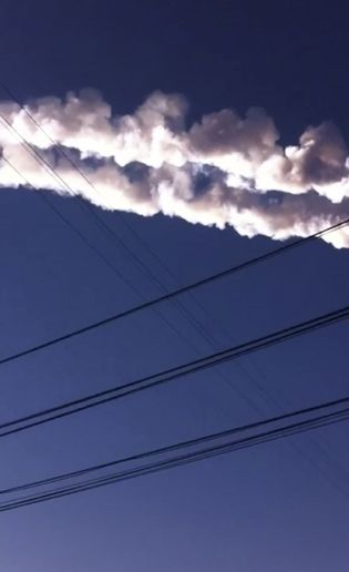 Feb. 15, 2013: In this photo taken with a mobile phone camera, a meteorite contrail is seen in Chelyabinsk region.  Source: AP Photo/Sergey Hametov