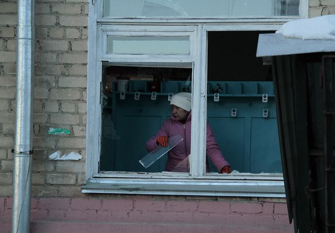Feb. 15, 2013: In this photo provided by Chelyabinsk.ru, a woman cleans away glass debris from a window after a meteorite explosion over Chelyabinsk region. (AP Photo/ Yevgenia Yemelyanova)Source: AP2013