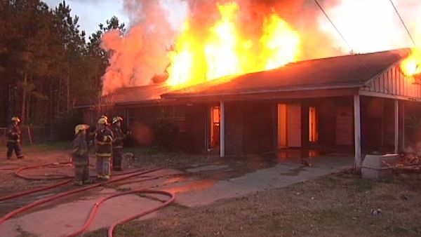 House on fire after setting snake on fire