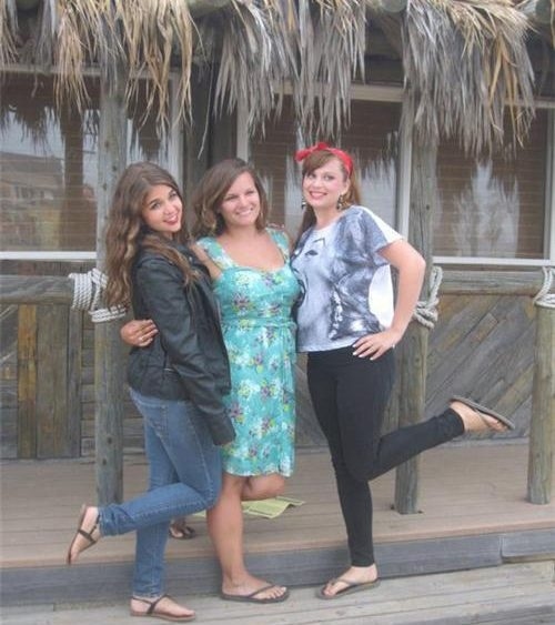 shirt with womans face biting boob of friend next to her