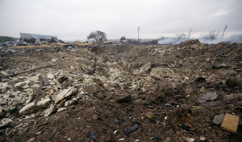 A blast crater sits in the remains of a fertilizer plant destroyed by an explosion in West, Texas, Thursday, April 18, 2013. (AP Photo/LM Otero) Source