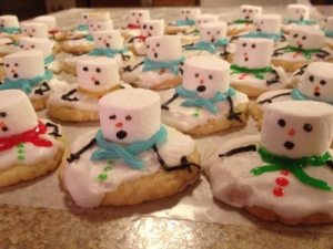 Melting snowman shaped cookies.
